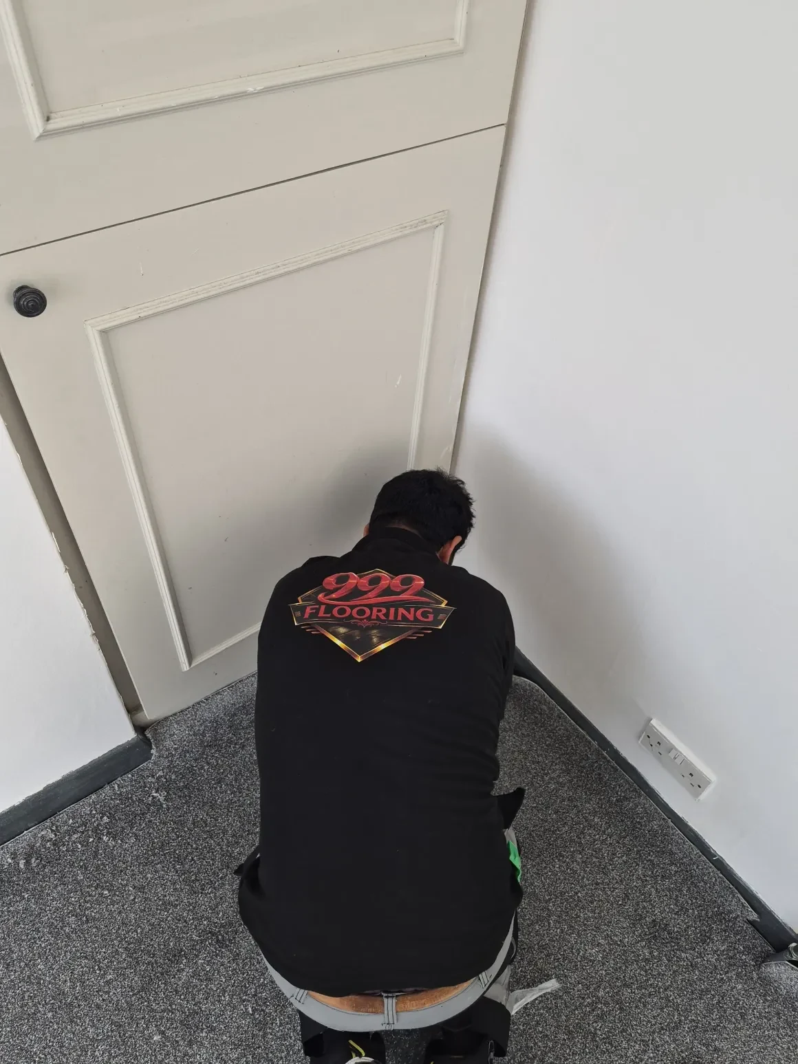 999 Flooring fitter installing carpet in a client home